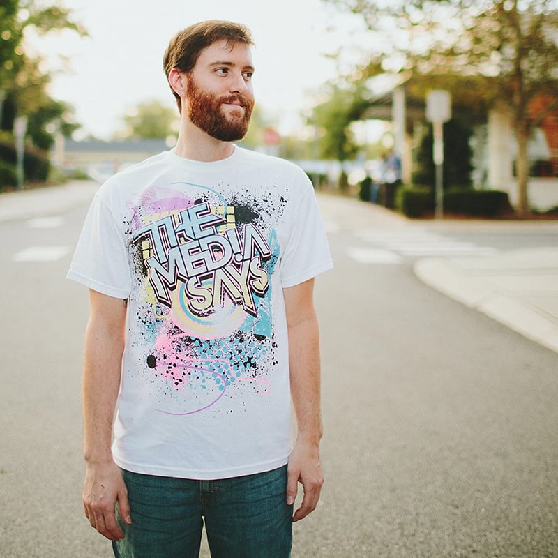 Bearded man wearing a white tee-shirt with a custom design