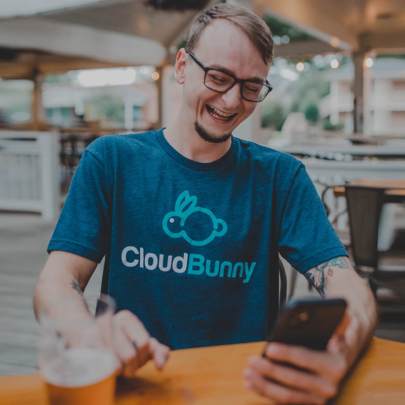 Smiling man wearing a soft tee